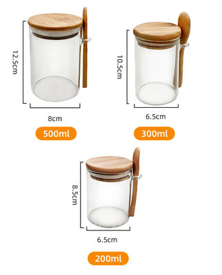 Thực phẩm Quả kính tròn Thùng tre với nắp và muỗng kẹo Các loại gia vị Cà phê hạt bánh quy